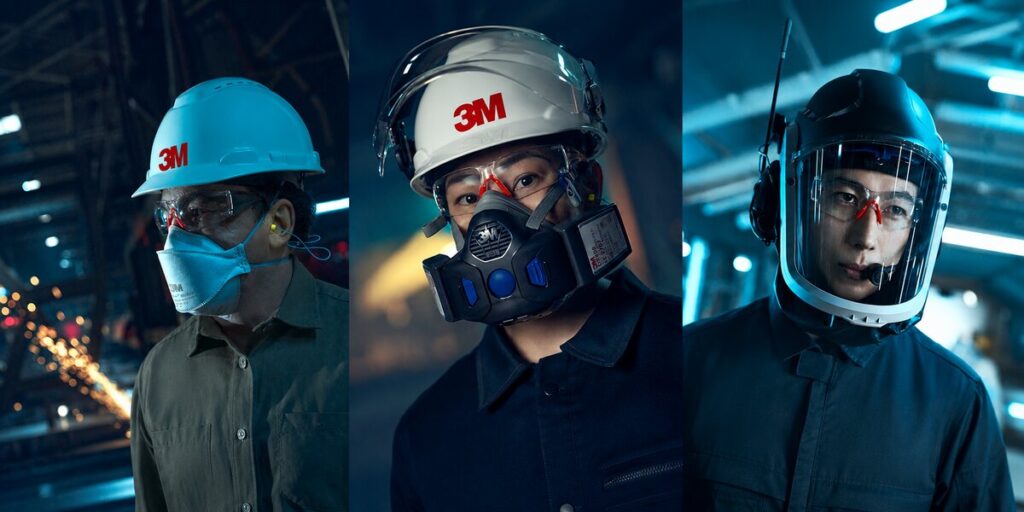 Drie medewerkers met verschillende vormen van 3M ademhalingsbescherming, waaronder een FFP-stofmasker, een halfgelaatsmasker en een volgelaatsmasker.