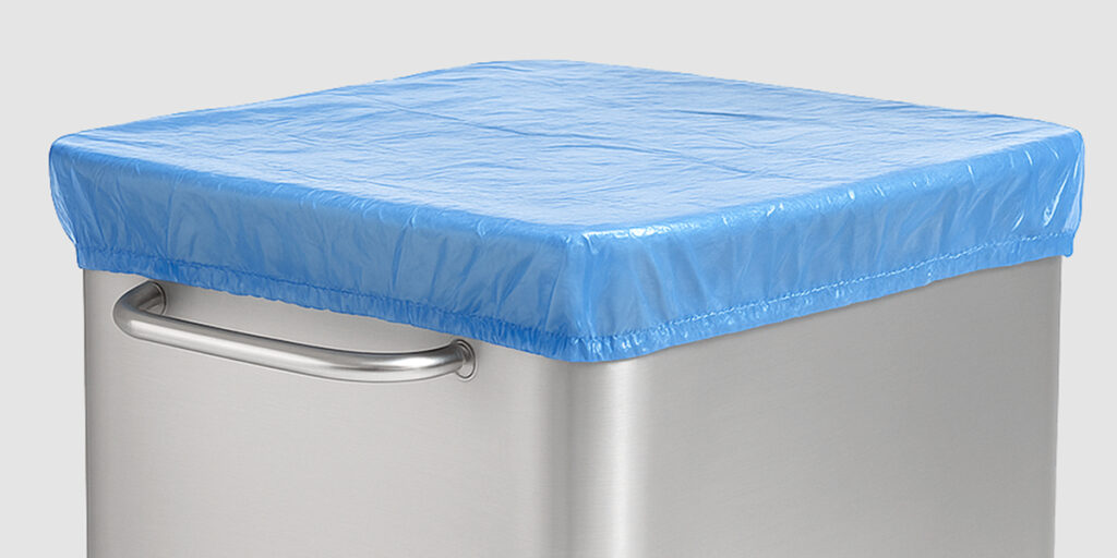 Blue PE cover sheet with elastic over a stainless steel norm trolley.
