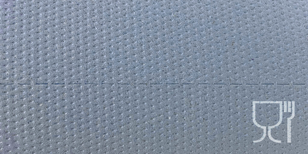 Close-up of grey hygienic paper texture with a food safe icon.