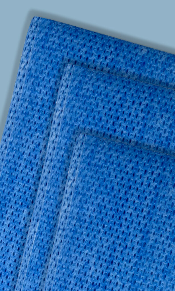 An image of several blue Conan cleaning cloths (Color Wipes) stacked on top of each other.