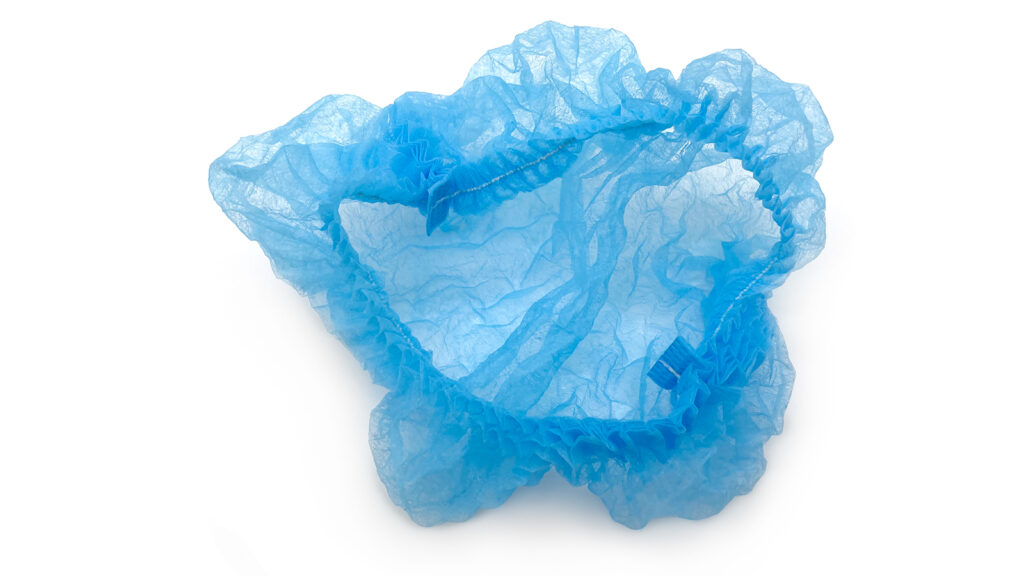 Blue disposable hairnet with elastic edge for hygienic use.