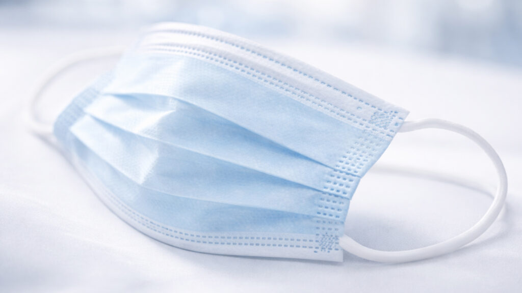 An image of a Type IIR medical face mask in a hygienic, clean environment.