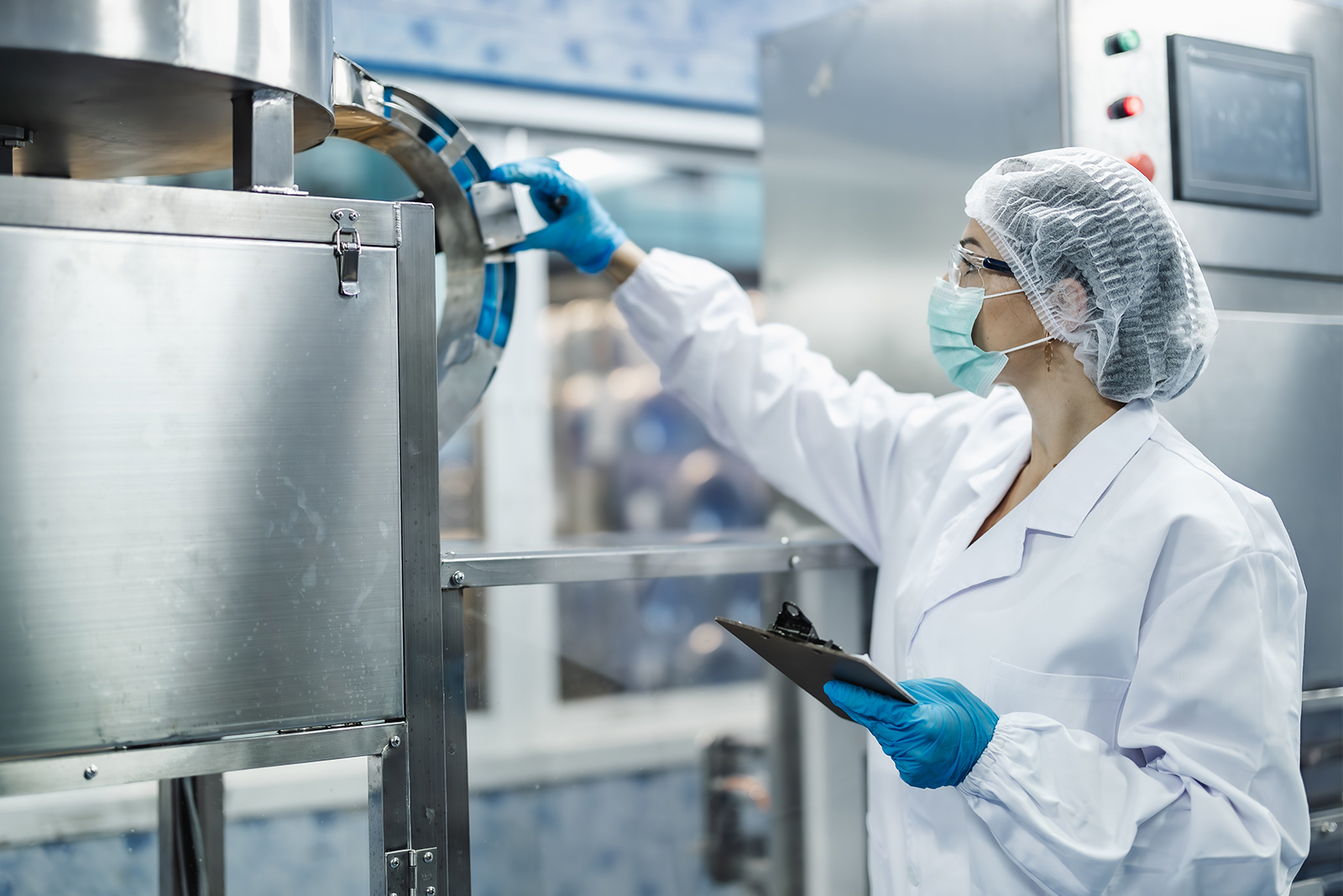 Employee carrying out a quality control check on a production installation