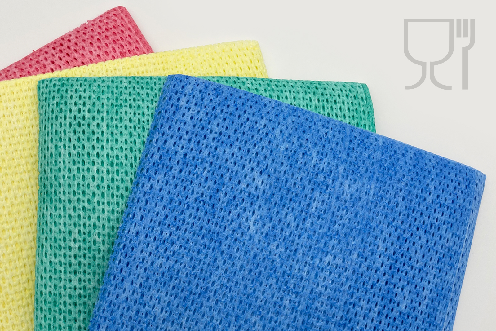 A close-up of colourful cleaning cloths with a coarse open structure