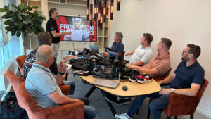 PPE presentation to a group of attendees in a meeting room.