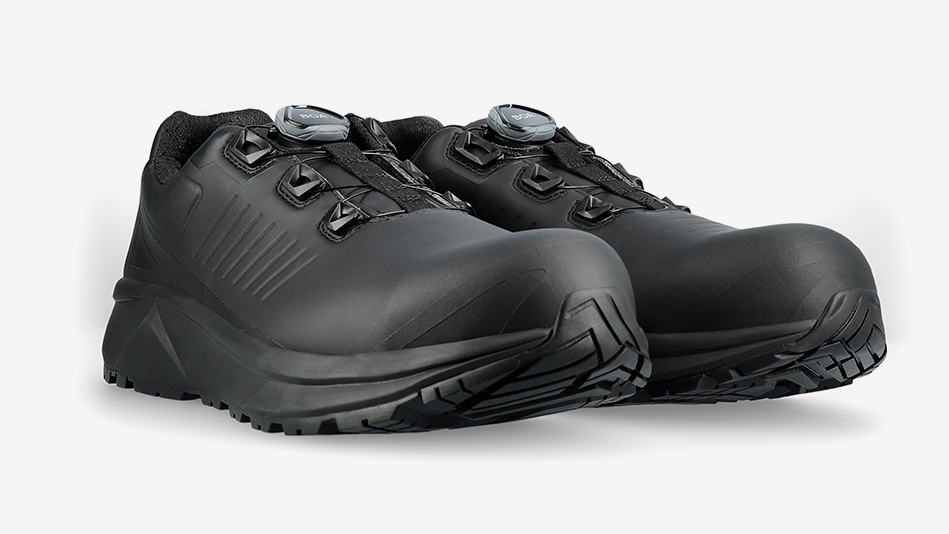 A pair of black safety shoes with a BOA Fit System closure, displayed against a light grey background.